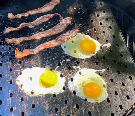 Photo of Fried Eggs on the flat side. You heard that right, eggs on the grill! Hot GrillGrates make for minimal fall-through!